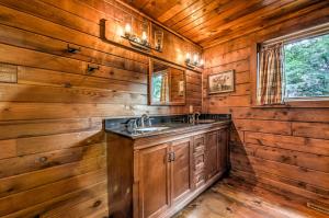 a bathroom with a sink in a wooden cabin at Ridge Top Lodge in Blue Ridge +48 photos