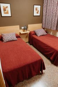 Posteľ alebo postele v izbe v ubytovaní Hotel Anna