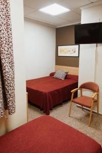 Posteľ alebo postele v izbe v ubytovaní Hotel Anna