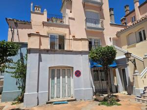 a building with a door in front of it at Luxury apartment puerto sherry in El Puerto de Santa María