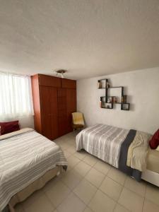 Ένα ή περισσότερα κρεβάτια σε δωμάτιο στο Apartamento en planta baja c estacionamiento
