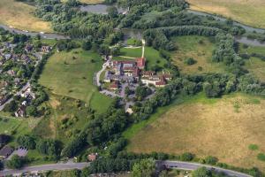 an aerial view of a small village on a hill at voco Oxford Thames by IHG in Oxford
