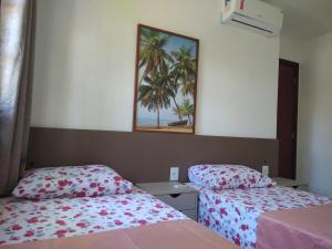 Ένα ή περισσότερα κρεβάτια σε δωμάτιο στο Praia do Forte Sensacional