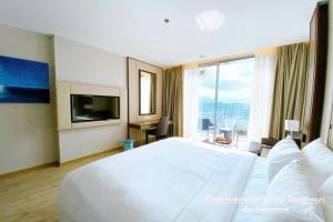 Panorama Nha Trang Residences by Luxanova客房内的一张或多张床位