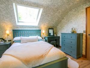 Ένα ή περισσότερα κρεβάτια σε δωμάτιο στο The Hideaway