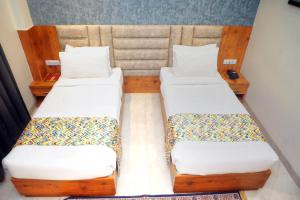 Postel nebo postele na pokoji v ubytování Hotel Marine House