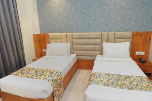Postel nebo postele na pokoji v ubytování Hotel Marine House