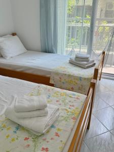 Ένα ή περισσότερα κρεβάτια σε δωμάτιο στο Kyanth Apartment