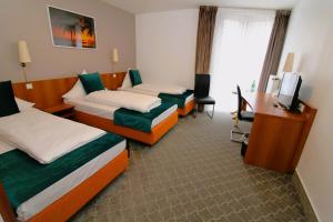 Ein Bett oder Betten in einem Zimmer der Unterkunft Concorde Hotel Ascot