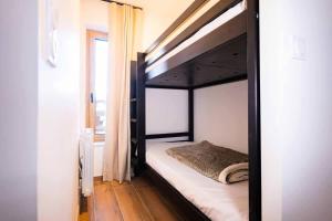a bedroom with a bunk bed in a room at Appartement 3 Pièces 6 Personnes MAE-4333 in Vars +8 photos