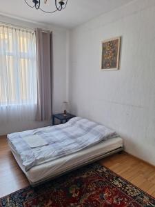 a bedroom with a bed in a room at Pod Białym Żaglem in Gdańsk +7 photos
