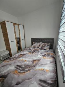 Postel nebo postele na pokoji v ubytování Rejjan APARTMANI