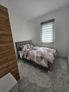 Postel nebo postele na pokoji v ubytování Rejjan APARTMANI
