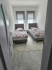 Postel nebo postele na pokoji v ubytování Rejjan APARTMANI