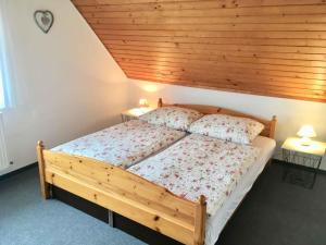 a bedroom with a bed with a wooden ceiling at Holiday home in Balatonmariafürdo 38170 in Balatonmáriafürdő