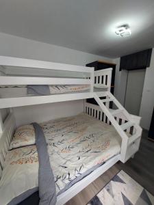 Postel nebo postele na pokoji v ubytování Golden view apartman