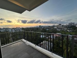 a balcony with a view of a city at Tropics City Supreme Black Theme Large Balcony City View至尊黑主题大阳台城市风景民宿 in Kuching