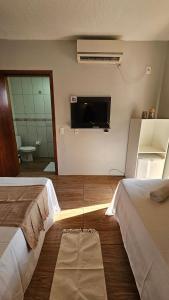 Et tv og/eller underholdning på Suítes Recanto Praia Grande