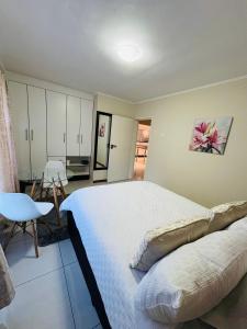 Ένα ή περισσότερα κρεβάτια σε δωμάτιο στο Goshen villas +14 φωτογραφίες