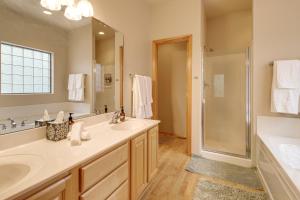 a bathroom with two sinks and a shower at Unwind Fireside! Home 30 Mi to Sunrise Ski Resort in Pinetop +19 photos