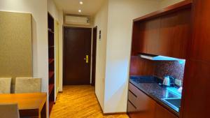 a kitchen with a counter top and a stove top oven at Dreamland Oasis 1 Studio in Chakvi