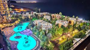 an aerial view of a resort at night at Dreamland Oasis 1 Studio in Chakvi