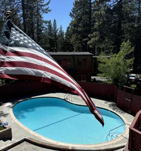 an american flag flying over a swimming pool at Heavenly Valley Townhouses in South Lake Tahoe