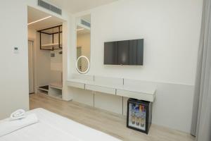 Postel nebo postele na pokoji v ubytování Laid Hotel