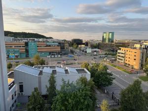 an aerial view of a city with buildings and a street at Panorama City View Apartment in Vilnius