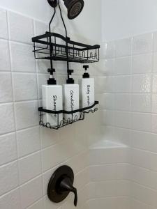 a bathroom with a shelf with four towels and a sink at Cowboy Hot Tub and Alleged Alien Sightings in Alton +13 photos