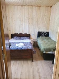 Postel nebo postele na pokoji v ubytování Agro Guest House Tsiskari in Machakhela