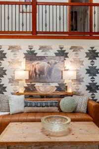 a living room with a couch and a table at Creek-Hot Tub-View-Pets-10min DT in Durango