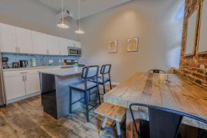 a kitchen with a wooden table and chairs in it at 4 Bed 2 Bath 200mbps Internet Luxury Keyless Entry in Boston