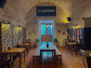 a restaurant with tables and chairs in a room at Viajero Arequipa Hostel in Arequipa