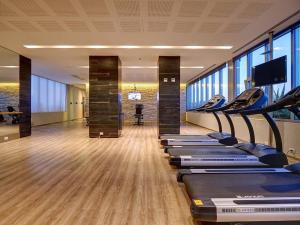 a gym with a row of treadmills in a building at Apartment in central Palermo, BsAs, full amenities in Buenos Aires