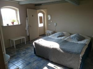 Katil atau katil-katil dalam bilik di Bed & Breakfast Vinkille