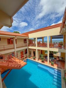an aerial view of a hotel with a swimming pool at Grand Plaza in San Juan del Sur