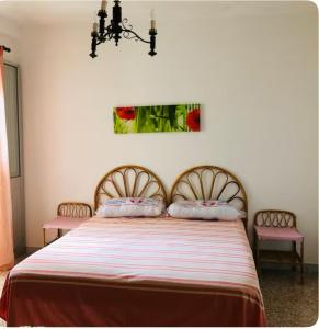 Postel nebo postele na pokoji v ubytování Casa Bella Poesia
