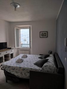 Posteľ alebo postele v izbe v ubytovaní Domus Graziana - Lake Front