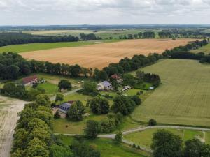 an aerial view of a farm with a field at Ferienwohnung Wittkatis, ländlich, Nähe Schweriner See in Moltow