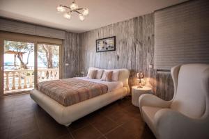 Postel nebo postele na pokoji v ubytování Seaside Villa Margarita