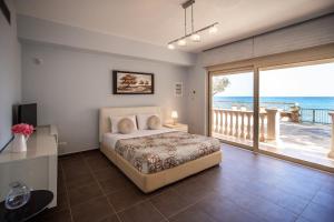 Postel nebo postele na pokoji v ubytování Seaside Villa Margarita