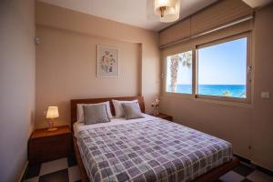 Postel nebo postele na pokoji v ubytování Seaside Villa Margarita
