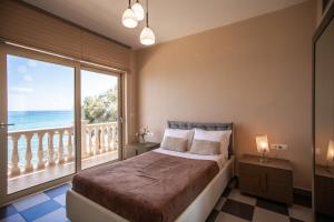 Postel nebo postele na pokoji v ubytování Seaside Villa Margarita