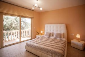 Postel nebo postele na pokoji v ubytování Seaside Villa Margarita