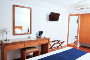 Postel nebo postele na pokoji v ubytování Hotel Calli