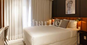 Iconyc Charlie Ibirapuera Hotel客房内的一张或多张床位