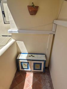 a dog house sitting in the middle of a staircase at Pied-à-Terre in Piazzetta in Capri