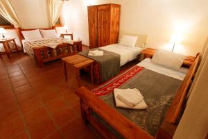 Postel nebo postele na pokoji v ubytování Ionia Guest House
