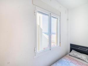 Postel nebo postele na pokoji v ubytování Apartment near the beach with sea views